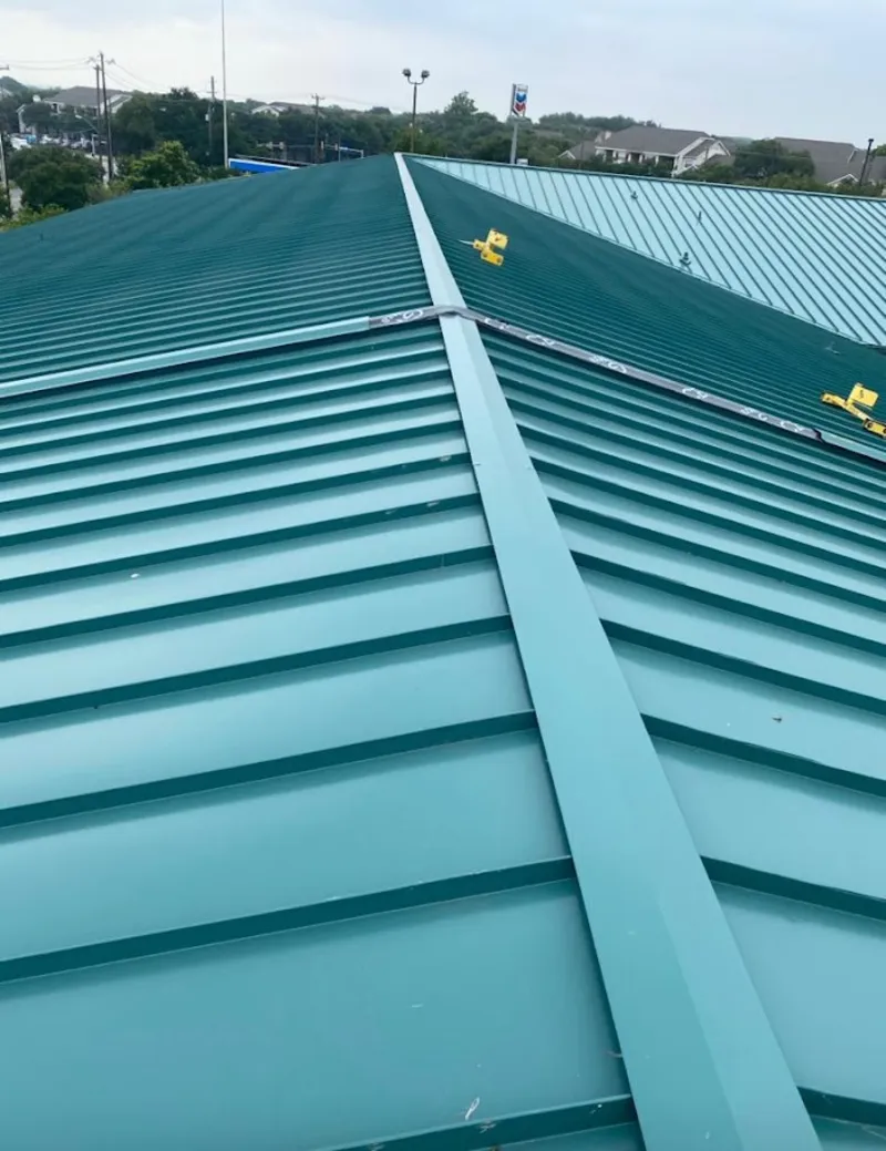 Green commercial metal roof ridge and valley for Metal Roof Repair in Logan